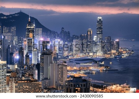 Wonderful aerial view of skyscrapers in downtown of Hong Kong at sunset. Awesome cityscape. Hong Kong is a popular tourist destination of Asia.
