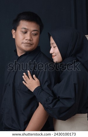 Asian couple in various styles on a black background