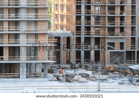 Construction site. Scaffolding. Building frame. Exterior of unfinished building. Modern civil engineering. Construction industry