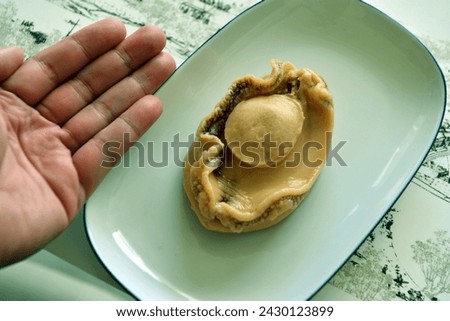 Haliotis, common name abalone, is the only genus in the family Haliotidae.  Royalty-Free Stock Photo #2430123899