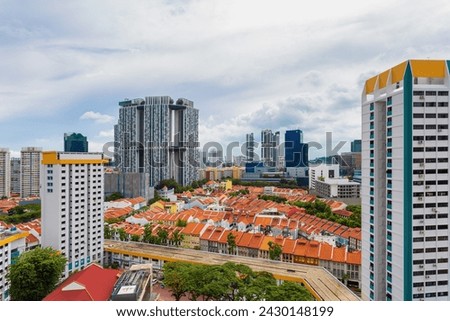 Modern and Traditional Skyline in Singapore, Contrast between historical shophouses and modern high-rise buildings in Singapore's dynamic urban landscape. Royalty-Free Stock Photo #2430148199