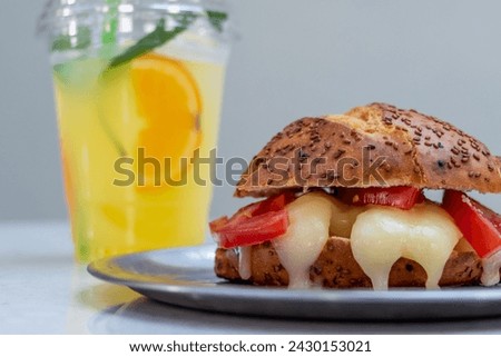 the concept of local quick snack dough foods, baked or deep-fried unhealthy meals, breakfast food concept, tea, cheese pastry, bagel, orange juice, banana milk