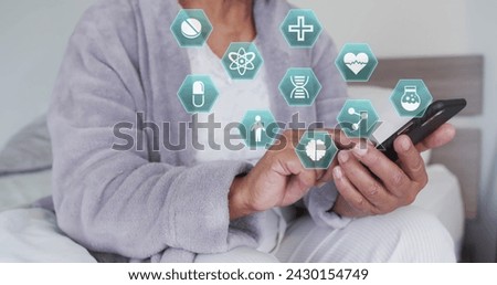 Image of network of medical icons over senior woman using smartphone. medical services, healthcare and technology concept digitally generated image.