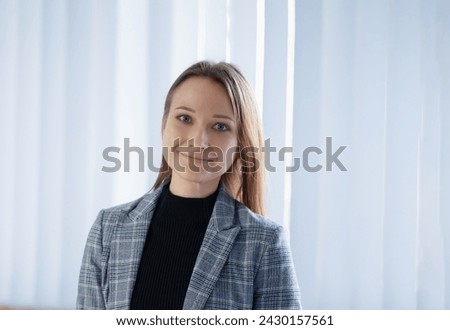 young happy businesswoman in office Royalty-Free Stock Photo #2430157561