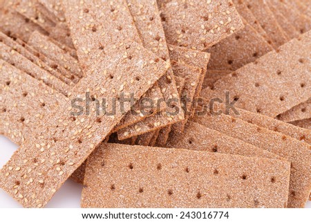 Pile of crackers with sesame seeds close-up picture.