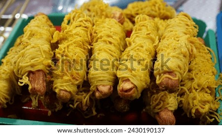 Rolled noodle sausages are sold at the night market in Balige Indonesia. January 11 2024. Balige, North Sumatra Indonesia
