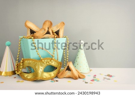Purim celebration concept (jewish carnival holiday). Hamantaschen cookies over table