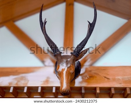 This is a deer head made out of wood but looks very nice Royalty-Free Stock Photo #2430212375