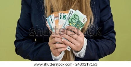 Female hands counting large amount EU euro money. Saving or investment concept