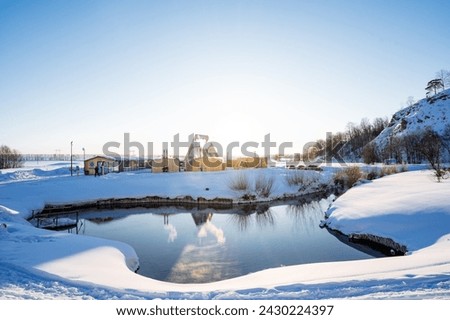 Beautiful winter landscape on a lake in the countryside, a mountain resort of thermal springs, camping in the open air. High quality photo