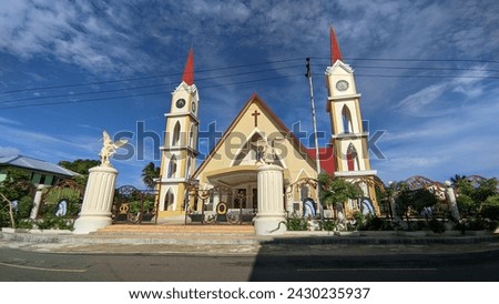 Catholic church with tower and blue sky background