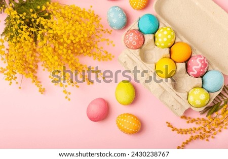 Easter eggs on a bright pink background. Easter celebration concept. Colorful easter handmade decorated Easter eggs. Place for text. Copy space.