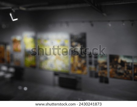 exhibition hall in a modern gallery. Interior of modern art gallery with paintings on walls. Image in Art Gallery Museum, Abstract Blur or Defocus Background