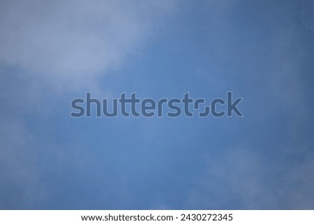 Natural pattern. Cloudy blue sky background. Calm sky and bright clouds in sunlight. Wallpaper. Horizontal photo. Gradient. No people, nobody. 