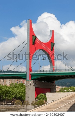 Bridge 'Prince and Princes of Spain' or La Salve Bridge with remarkable arch 'The Red Arc' created by Daniel Buren