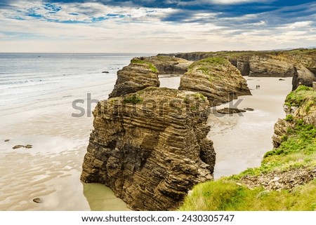 Cliff formations on Cathedral Beach in Galicia Spain. Playa de las Catedrales, As Catedrais in Ribadeo, province of Lugo. Cantabric coastline in northern Spain. Tourist attraction. Royalty-Free Stock Photo #2430305747