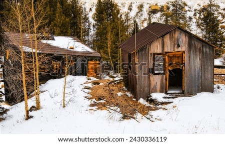 Photo of an abandoned cabin in the snow, during the winter, in the mountains outside of Silver Plume, Colorado