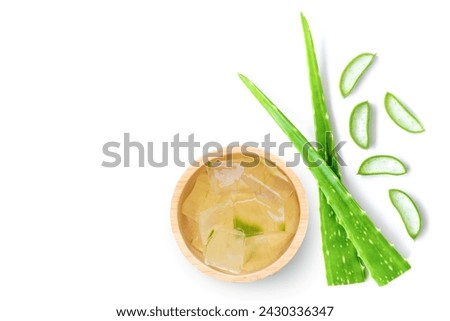 Aloe vera gel with cactus green leaf on white background. Top view, flat lay.
