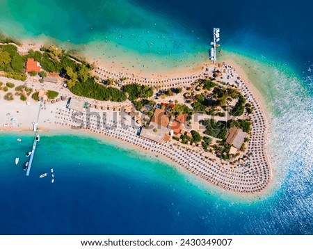 Blue Lagoon and Oludeniz beach aerial panoramic view. Oludeniz is a beach resort in the Fethiye district of Mugla Province, Turkey. Royalty-Free Stock Photo #2430349007