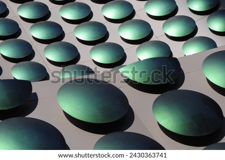 Abstract pattern formed by green polka dots, in the decoration of a building in the area of The Strip in Las Vegas