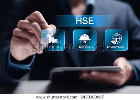 HSE, Health safety environment concept. Standard safe industrial work and industrial. Businessman use tablet with HSE icon on virtual screen for business and organization. 