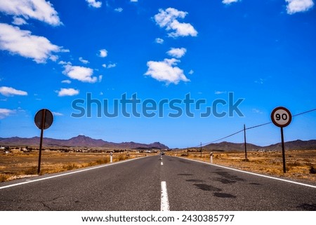 Photo Picture of a Beautiful Asphalt Lonely Road Royalty-Free Stock Photo #2430385797