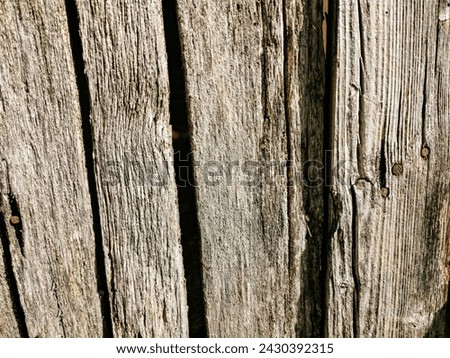 very old wooden surface, backdrop, background. Front view of an old wooden fence for inscription.
