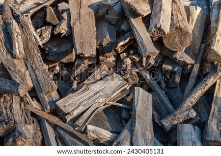 Closeup of old dirty firewood pile