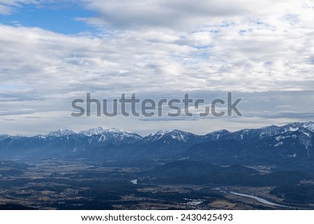 View from the Carinthian mountain Görlizen to the Karawanken ridge and Lake Ossiacher in winter Royalty-Free Stock Photo #2430425493