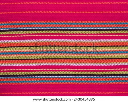 Colorful linear patterns of a cloth dishtowel Royalty-Free Stock Photo #2430454395