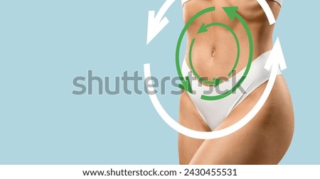 Healthy lifestyle, nutrition, detox concept. Cropped of slim woman wearing white panties posing on blue, circle arrows over well-fit lady waist, results of weight loss diet, panorama with copy space