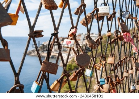 Fence with padlocks attached to it, declarations of love, love padlocks, signs of love forever, Dubrovnik, Croatia Royalty-Free Stock Photo #2430458101