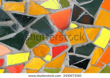 Vintage colorful mosaic background. Mosaic pattern texture close up in retro style. Colorful polygons background.