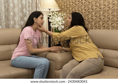 Caring mother talk comfort unhappy sad teenage daughter suffering from psychological problems, loving mom support make peace with depressed introvert grown up girl. Royalty-Free Stock Photo #2430483041