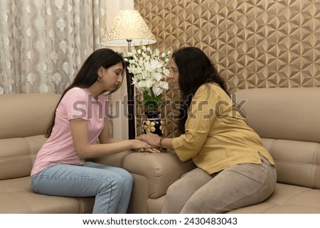 Caring mother talk comfort unhappy sad teenage daughter suffering from psychological problems, loving mom support make peace with depressed introvert grown up girl. Royalty-Free Stock Photo #2430483043
