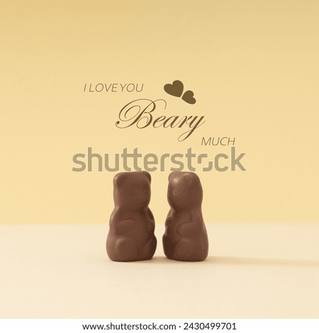 Creative layout of chocolate teddy bears with message "I love you beary much" on pastel cream background. Romantic love concept. Yummy sweet food idea. Minimal style. Chocolate aesthetic.
