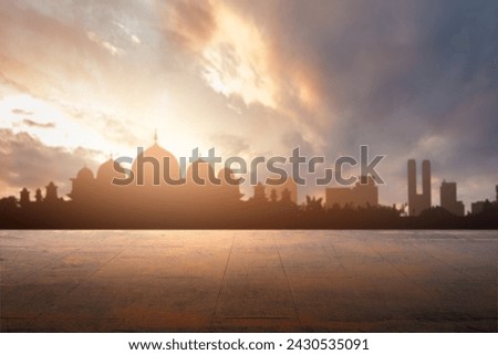 Outdoor floor with a view of a silhouette of the mosque with a dramatic sky view background. Islamic background