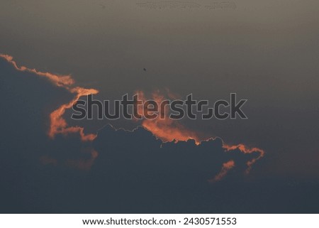 A sunset seen in the sky in Nakhon sawan province, north of Bangkok on February 23, 2024. Royalty-Free Stock Photo #2430571553