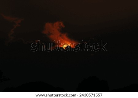 A sunset seen in the sky in Nakhon sawan province, north of Bangkok on February 23, 2024. Royalty-Free Stock Photo #2430571557