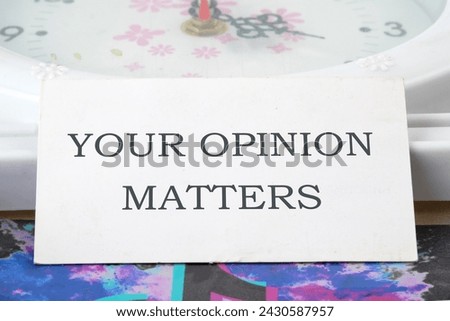 YOUR OPINION MATTERS phrase written on a white business card