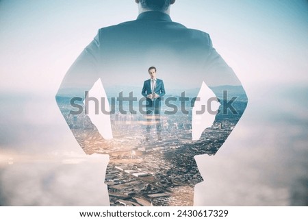 A conceptual image of a businessman silhouette with an overlay of cityscape representing ambition and success in the corporate world