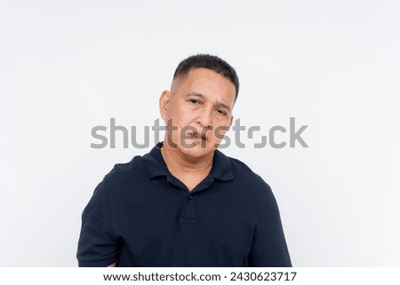 A portrait of a middle aged man with a blank expression and glazed eyes, isolated against a white backdrop. Royalty-Free Stock Photo #2430623717