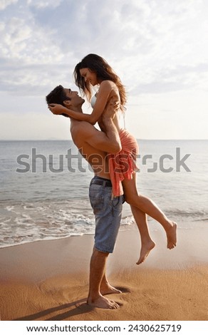 Love, waves and couple playing on beach for travel adventure, summer island holiday and relax. Ocean vacation, woman and man in nature on romantic date together with smile, embrace and sea in Bali. Royalty-Free Stock Photo #2430625719