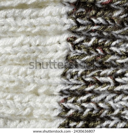 Pattern fabric made of wool. Handmade knitted fabric grey white wool background texture