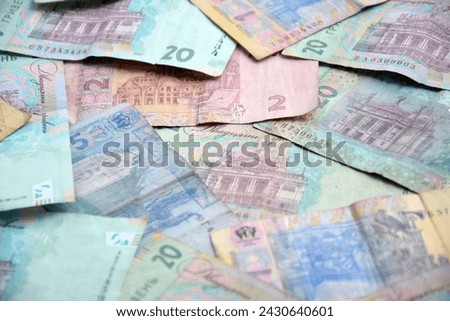 Processed collage of Ukrainian Hryvnia UAH bills banknotes texture. Background for banner, backdrop or texture for 3D mapping