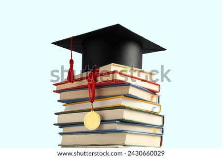 Graduation cap and books for education day