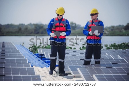 Software engineers collaborate, discuss ways to enhance a smart energy analytics app for floating solar operation. Real-time monitoring optimizes data usage, analyzes efficient consumption insights.
