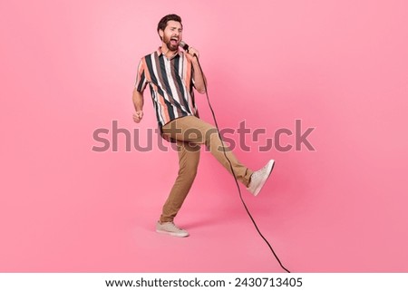 Full body length size photo of professional singer mature man microphone performance showman isolated over pastel pink color background Royalty-Free Stock Photo #2430713405