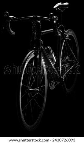 Road bike. Low-key lighting. Isolated on a pure black background.