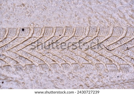 Texture of wet sand with Wheel track background
